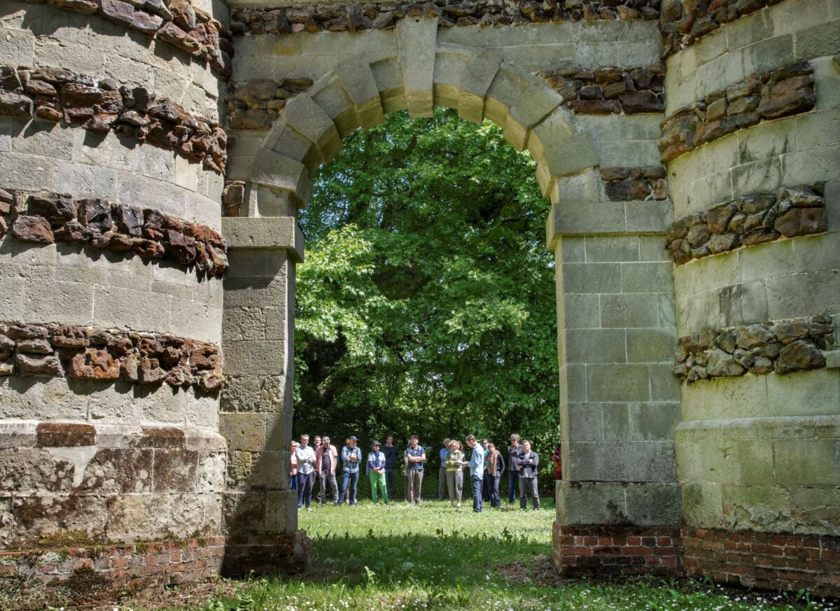 The Realisation Festival Gathering by St Giles Castellated Arch