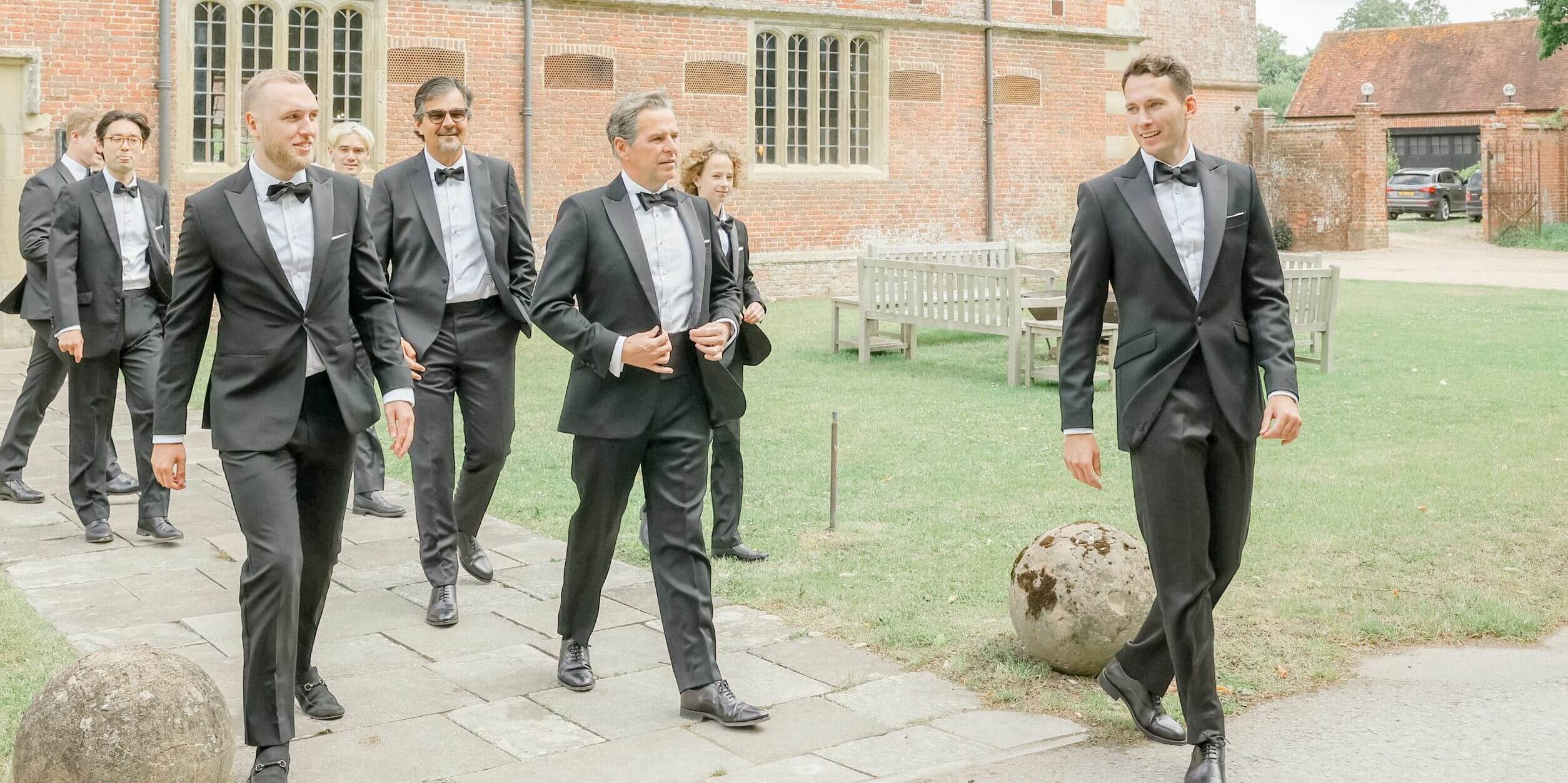 Groom and Grooms Men Walking From Riding House Accommodation to St Giles House for Wedding