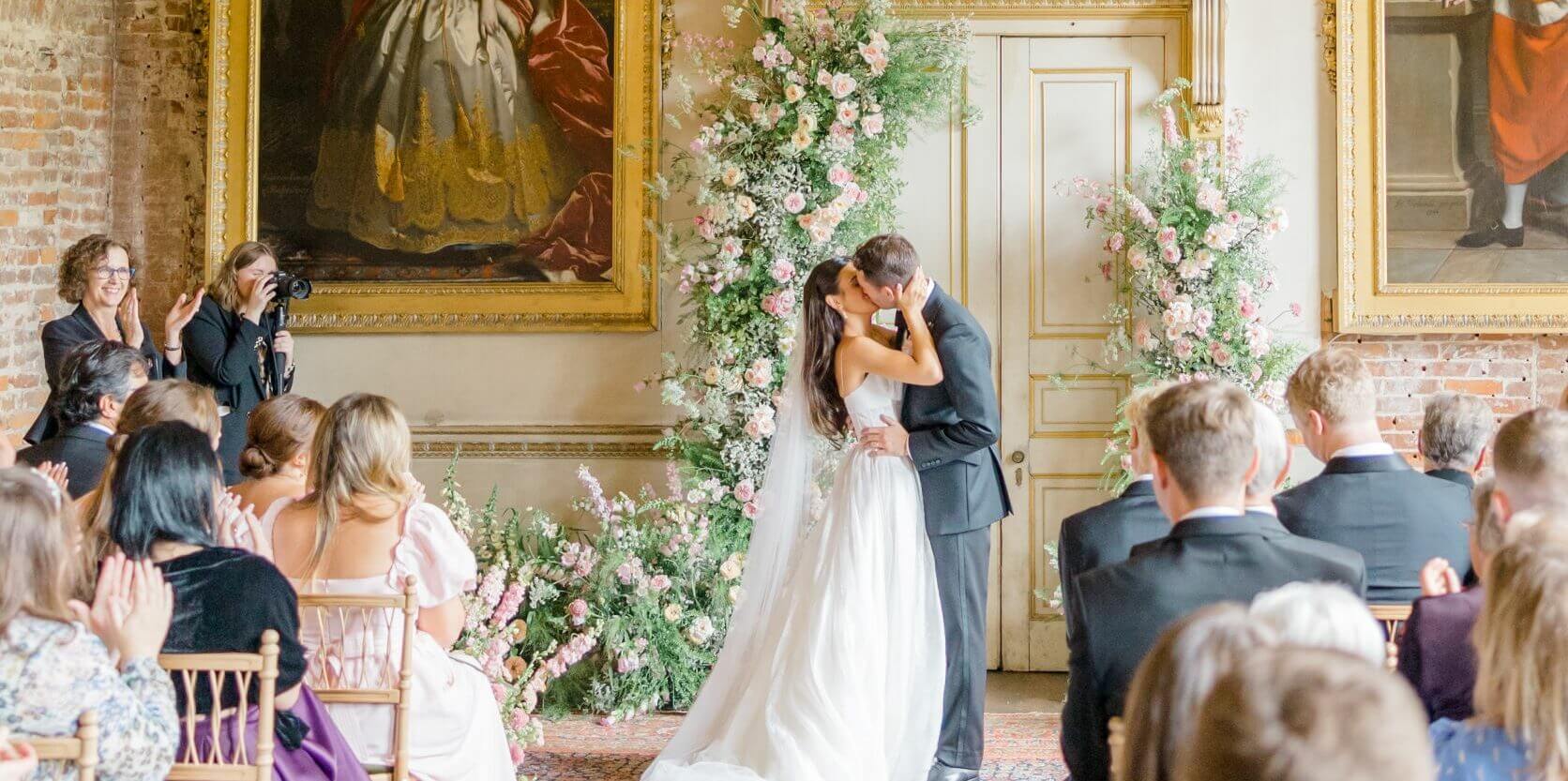 St Giles House Wedding Ceremony in the Great Dining Room Couples First Kiss