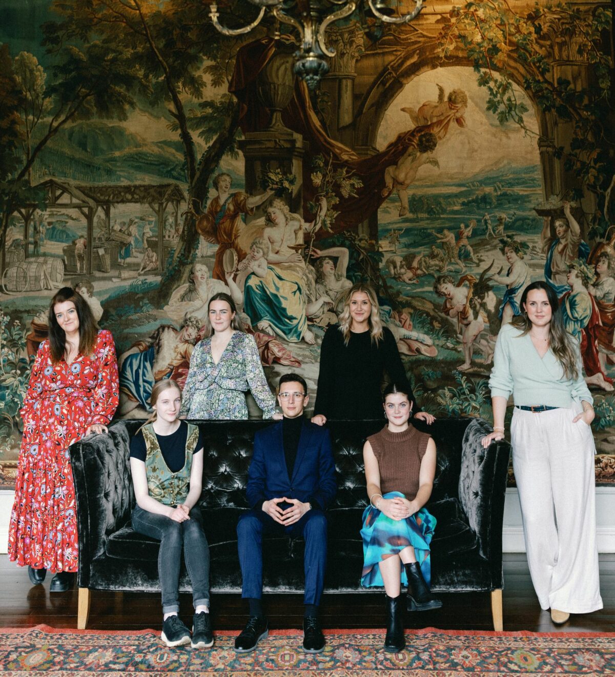 St Giles House wedding and events team and coordinators seated in tapestry room