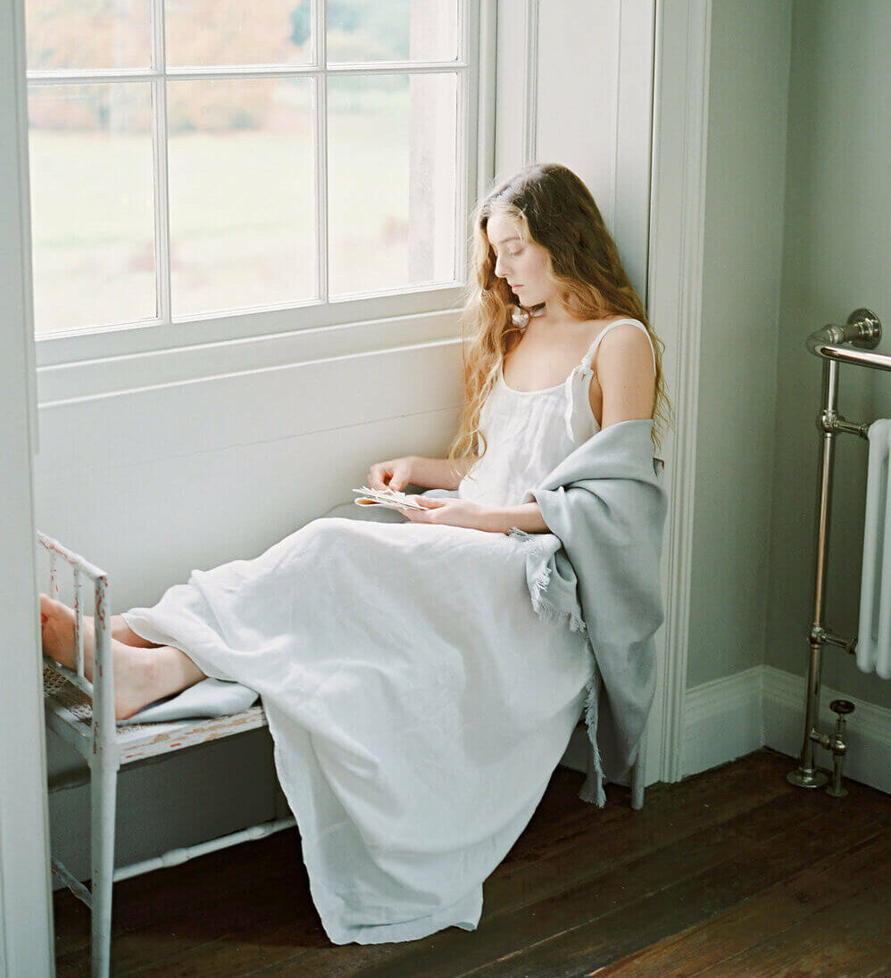 Retreat attendee relaxes in spacious St Giles House window seat